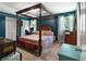 Spacious main bedroom with four-poster bed, hardwood floors, and natural light at 83 Andrew Jackson Ct, Dallas, GA 30157