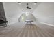 Large carpeted bedroom featuring a vaulted ceiling, ceiling fans, and natural light at 1101 N Flat Rock Rd, Douglasville, GA 30134
