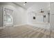 Large carpeted bedroom with access to additional rooms and a flat-screen television at 1101 N Flat Rock Rd, Douglasville, GA 30134