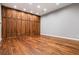Spacious bedroom with hardwood floors and custom wood closets, offering ample storage at 1101 N Flat Rock Rd, Douglasville, GA 30134