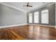 Spacious bedroom with three windows, decorative trim work and hardwood flooring at 1101 N Flat Rock Rd, Douglasville, GA 30134