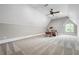 Bright bedroom with a ceiling fan, large window, and plenty of space at 1101 N Flat Rock Rd, Douglasville, GA 30134