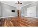 Large bedroom features hardwood flooring, a ceiling fan, and a walk-in closet at 1101 N Flat Rock Rd, Douglasville, GA 30134