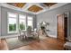 Bright dining room featuring light gray walls, hardwood floors, and large windows offering natural light at 1101 N Flat Rock Rd, Douglasville, GA 30134