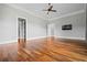 Open room with hardwood floors, neutral walls, and recessed lighting for customization and style at 1101 N Flat Rock Rd, Douglasville, GA 30134