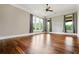 Bright, spacious room with hardwood floors, large windows, and ample natural light at 1101 N Flat Rock Rd, Douglasville, GA 30134