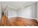 Spacious room with hardwood flooring, neutral walls, and ample natural light, ready for personalization at 1101 N Flat Rock Rd, Douglasville, GA 30134