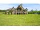Stately home with a sprawling lawn, boasting an impressive exterior with stone accents at 1101 N Flat Rock Rd, Douglasville, GA 30134
