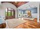 Elegant foyer featuring herringbone floors, wood-paneled ceiling, and an open view into the dining area at 1101 N Flat Rock Rd, Douglasville, GA 30134