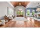 Stately foyer with a wood-paneled ceiling, herringbone wood floors, and a rustic wooden bench seat at 1101 N Flat Rock Rd, Douglasville, GA 30134