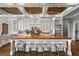 Custom kitchen featuring white cabinets, a wood-topped island, and pendant lighting at 1101 N Flat Rock Rd, Douglasville, GA 30134