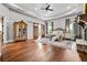 Luxurious main bedroom with tray ceiling, fireplace, barn doors, and hardwood floors at 1101 N Flat Rock Rd, Douglasville, GA 30134