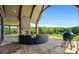 Inviting outdoor living space with fireplace and scenic views, creating a relaxing atmosphere at 1101 N Flat Rock Rd, Douglasville, GA 30134