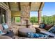 Cozy outdoor patio featuring comfortable furniture, a fireplace, and green scenic views at 1101 N Flat Rock Rd, Douglasville, GA 30134