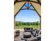 Inviting covered patio with comfortable seating, an outdoor fireplace, and scenic views of nature at 1101 N Flat Rock Rd, Douglasville, GA 30134