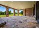 Covered patio featuring stone arches and natural light, perfect for enjoying the outdoors at 1101 N Flat Rock Rd, Douglasville, GA 30134