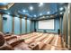 Home theater with seating, a large projection screen, and immersive surround sound at 1101 N Flat Rock Rd, Douglasville, GA 30134