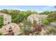 Aerial shot of a neighborhood with beautiful green trees, a community pool, and well-maintained apartment buildings at 1502 River Green Nw Dr # 1502, Atlanta, GA 30327