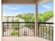 Balcony overlooking the complex featuring a community pool and beautiful green trees at 1502 River Green Nw Dr # 1502, Atlanta, GA 30327