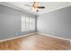 Bedroom with hardwood floors, ceiling fan, and natural light from the window at 1502 River Green Nw Dr # 1502, Atlanta, GA 30327