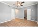 A main bedroom with hardwood floors and doors leading to the closet and bathroom at 1502 River Green Nw Dr # 1502, Atlanta, GA 30327