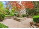 Enjoy the peaceful courtyard with beautiful landscaping and stone benches at 1502 River Green Nw Dr # 1502, Atlanta, GA 30327