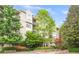 A beautifully landscaped complex with mature trees and manicured gardens at 1502 River Green Nw Dr # 1502, Atlanta, GA 30327