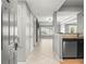Hallway leading to an open-concept living room and kitchen with tiled floors at 1502 River Green Nw Dr # 1502, Atlanta, GA 30327