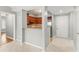 Hallway with an opening to a kitchen, an entrance, and a view of the open living room at 1502 River Green Nw Dr # 1502, Atlanta, GA 30327