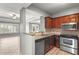 Kitchen with granite countertops and stainless steel appliances overlooking the living area at 1502 River Green Nw Dr # 1502, Atlanta, GA 30327