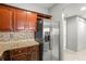 Kitchen featuring stainless steel appliances, granite countertops, and cherry wood cabinets at 1502 River Green Nw Dr # 1502, Atlanta, GA 30327