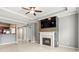 Living room with a fireplace, ceiling fan, and an open view to the kitchen at 1502 River Green Nw Dr # 1502, Atlanta, GA 30327