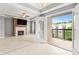 Light and bright living room with fireplace and doors to a covered outdoor deck at 1502 River Green Nw Dr # 1502, Atlanta, GA 30327