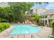 Resort style pool, surrounded by lush landscaping, and plenty of lounge chairs at 1502 River Green Nw Dr # 1502, Atlanta, GA 30327