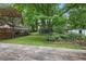 Landscaped backyard with a deck and storage shed at 203 Lucerne St, Decatur, GA 30030