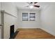 Charming bedroom with a decorative fireplace and a large window with natural light at 203 Lucerne St, Decatur, GA 30030
