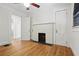 Bedroom with decorative fireplace, crown molding, and doors to other rooms at 203 Lucerne St, Decatur, GA 30030