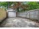 Detached garage with adjacent parking space and fenced yard at 203 Lucerne St, Decatur, GA 30030