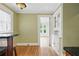 Hallway showcasing built-in shelving, hardwood floors, and an open doorway leading to other rooms at 203 Lucerne St, Decatur, GA 30030