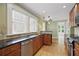 Bright eat-in kitchen features stainless steel appliances and granite countertops for a modern touch at 203 Lucerne St, Decatur, GA 30030