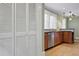 Bright kitchen includes stainless steel appliances and wooden cabinets that provide ample storage space at 203 Lucerne St, Decatur, GA 30030