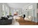 Stylish living room featuring hardwood floors, fireplace, French doors, and comfortable modern furniture at 203 Lucerne St, Decatur, GA 30030