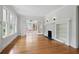 Bright and airy living room featuring hardwood floors, fireplace, and French doors to sunroom at 203 Lucerne St, Decatur, GA 30030