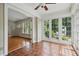 Sunroom with terracotta floors and many windows offering bright, natural light at 203 Lucerne St, Decatur, GA 30030