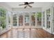 Bright sunroom featuring tile floors, a ceiling fan, and windows providing plenty of natural light at 203 Lucerne St, Decatur, GA 30030