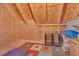 Unfinished attic space with exposed beams, plywood walls and storage shelves at 319 Parkside Meadow Dr, Marietta, GA 30064