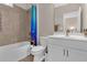 Bathroom featuring a bathtub with shower, toilet, sink, and vanity in light neutral tones at 319 Parkside Meadow Dr, Marietta, GA 30064