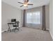 Spare bedroom with desk, ceiling fan, carpet flooring, and sheer curtains at 319 Parkside Meadow Dr, Marietta, GA 30064