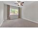 Bedroom with natural light, carpeted floor, and neutral walls at 319 Parkside Meadow Dr, Marietta, GA 30064