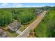 Elevated aerial perspective of home near lush greenery and other homes in a well-maintained neighborhood at 319 Parkside Meadow Dr, Marietta, GA 30064